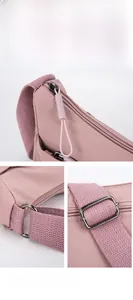 Vue macro détaillée de la fermeture éclair et du tissu en nylon d'un sac à bandoulière rose
