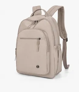Side view of lightweight beige hiking backpack with durable nylon fabric and front zipper pocket