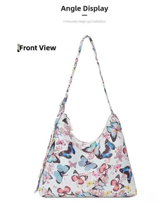 Front view of white shoulder bag featuring colorful butterfly prints and metal buckle