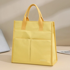 Minimalist bright yellow canvas tote bag with multi-functional pockets for office and daily use