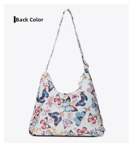 Back view of a white hobo bag featuring a vibrant all-over colorful butterfly print