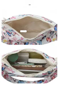Internal view showing large storage capacity of a butterfly print canvas shoulder bag