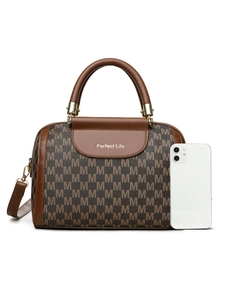 Detail of Boston bag with M-letter monogram print and top handles showing size comparison