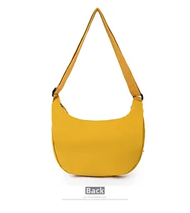 Back view of minimalist ginger yellow oxford crescent bag with adjustable shoulder strap