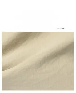Detailed close-up of durable nylon fabric texture with light beige weave pattern