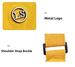 Detail view of yellow nylon bag featuring metallic LS logo and woven shoulder strap