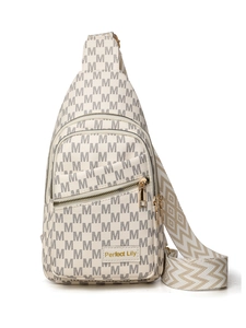 Close-up of cream crossbody bag featuring letter M pattern and woven shoulder strap