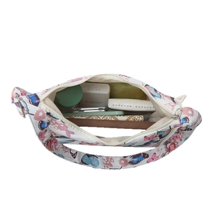 Minimalist underarm bag with butterfly print showing large inner capacity and zipper