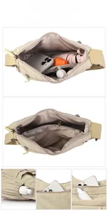 Detail view of large capacity beige nylon crossbody bag with multiple storage compartments