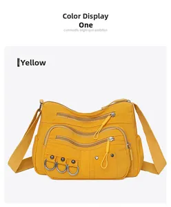 Detail view of yellow casual crossbody bag featuring multi-pocket design and D-ring accents