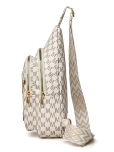 Detail of white monogram sling bag with gold hardware and woven geometric strap