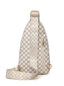 Detail of cream crossbody bag with M-letter monogram and geometric patterned strap