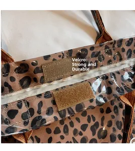 Detail view of the leopard print tote bag featuring a secure Velcro closure and brown straps