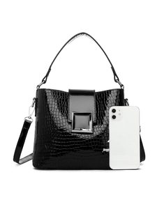 Detail of glossy crocodile pattern bucket bag with metal buckle and smartphone for scale