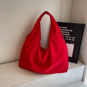 Large red canvas tote bag with drawstring details for casual commuting and daily use
