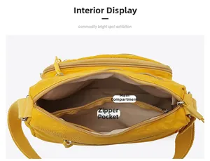 Detailed interior view of a spacious yellow crossbody bag with main pocket and zip pocket