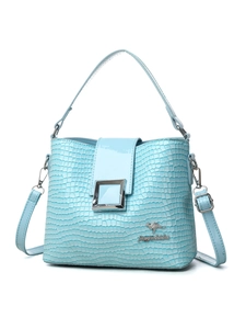 Detail of light blue embossed leather bucket bag with silver buckle and kangaroo logo