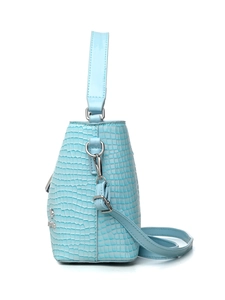 Side view of light blue crocodile texture bucket bag with silver hardware and shoulder strap