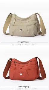 Detail of multi-layer nylon crossbody bags in beige and orange with metal logo