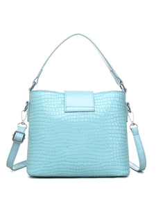 Close-up of light blue crocodile embossed bucket bag with silver metal buckles