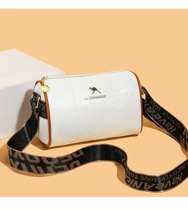 Detailed view of white crocodile pattern pillow bag with golden kangaroo logo and wide strap