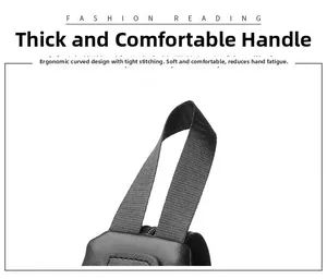 Detail of ergonomic padded handle with reinforced stitching on black travel backpack