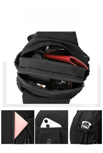 Detailed interior of high-capacity black oxford cross-body bag showing multiple storage sections
