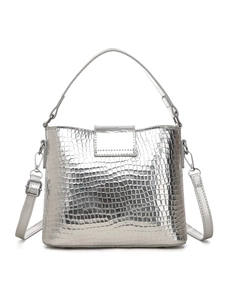 Detail of silver crocodile pattern texture on a stylish bucket bag with metal hardware
