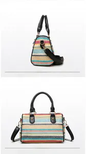 Front and back views of colorful striped woven beach bag with black leather handles