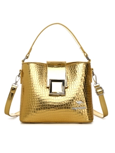 Detail of the golden crocodile texture PU leather surface and square metal buckle closure