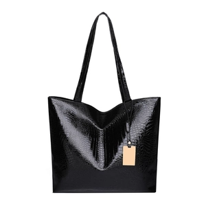 Classic black tote bag with glossy crocodile pattern and long shoulder straps