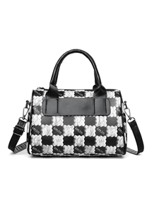 Detail of checkered canvas tote bag with adjustable shoulder strap and logo print