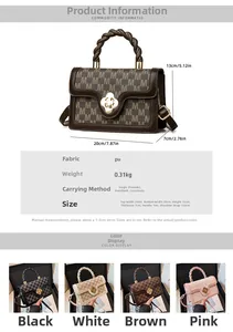 Detail view of M-letter print handbag with floral twist lock and adjustable strap