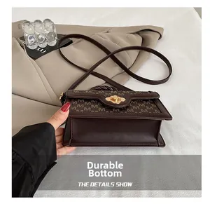 Detail of the durable wear-resistant base on this vintage brown monogram crossbody bag