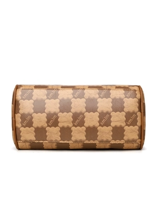 Detail of checkered brown leather barrel bag with floral brand lettering and fine stitching