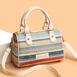 Colorful striped woven straw bucket bag with leather handles and crossbody strap