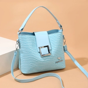 Fashionable light blue crocodile embossed bucket bag with silver metal buckle and strap