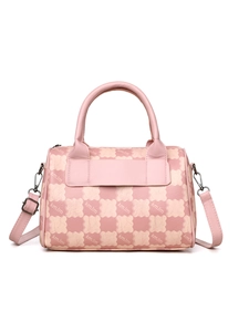 Close-up of pink leather Boston bag with bear pattern and adjustable shoulder strap