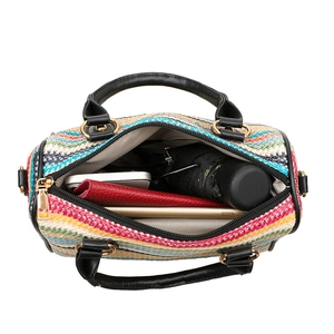 Colorful striped straw tote bag showing internal capacity for phone, wallet and umbrella