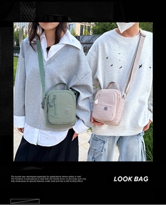 Detail of waterproof nylon crossbody bags in olive green and pale pink for daily use