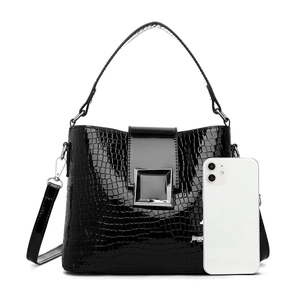Fashion black crocodile texture bucket bag with silver buckle and phone for scale
