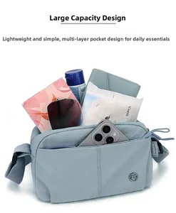 Detailed view of spacious Morandi blue crossbody bag showing daily essentials capacity