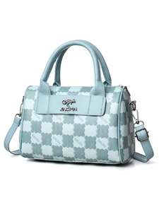 Close-up of light blue leather handbag with letter monogram print and gold kangaroo logo