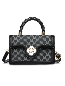 Detail of grey monogram fabric handbag with black leather trim and golden flower clasp