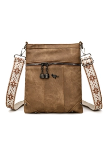 Macro detail of brown PU leather crossbody bag with decorative kangaroo logo and metal zipper