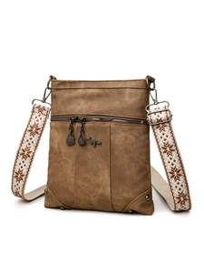 Brown canvas crossbody bag featuring vintage style with patterned strap and metal logo