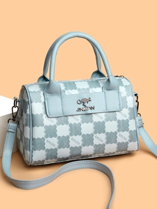 Detailed close-up of light blue Boston tote bag featuring kangaroo logo and plaid texture