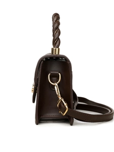 Detail of dark brown handbag showing twisted woven handle and gold hardware accents