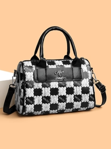 Detail of black and white checkerboard Boston bag with kangaroo logo and kmJm print
