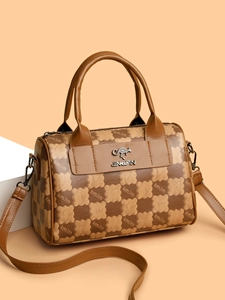 Detailed view of dark brown leather Boston bag with floral print and kangaroo emblem